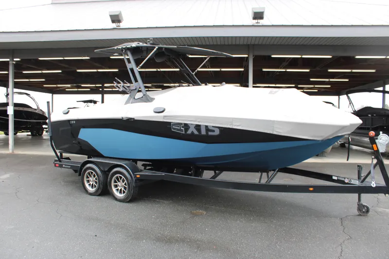 Slide: The Image of 2023 Axis A225 boat on trailer, covered, parked under shelter. - 21