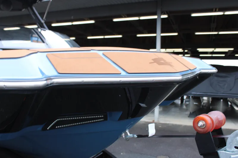 Slide: The Image of 2023 Axis A225 boat on trailer, showcasing sleek design and modern features. - 22