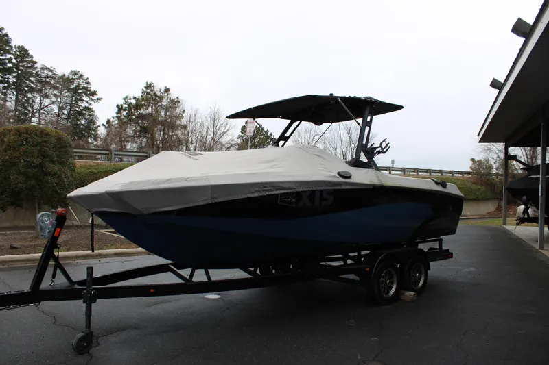Slide: The Image of 2023 Axis A225 boat on trailer, covered, parked outdoors. - 24