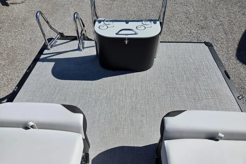 Slide: The Image of 2026 Avalon Platinum LSZ 2585 Quad Lounger Shift boat interior with seating and control panel. - 13