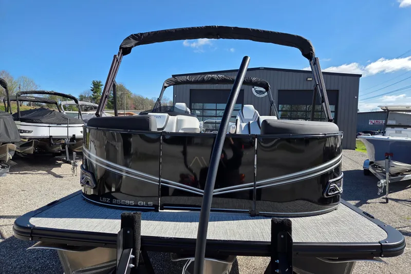 Slide: The Image of 2026 Avalon Platinum LSZ 2585 Quad Lounger Shift pontoon boat in a showroom. - 2
