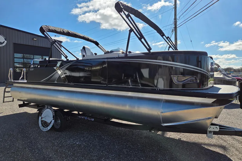 Slide: The Image of 2026 Avalon Platinum LSZ 2585 Quad Lounger Shift pontoon boat on display outdoors. - 3