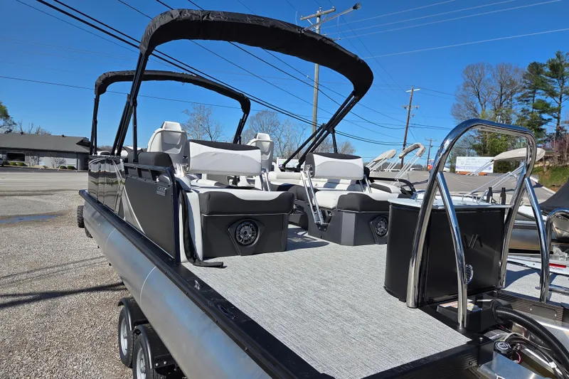 Slide: The Image of 2026 Avalon Platinum LSZ 2585 Quad Lounger Shift pontoon boat with sleek seating and canopy. - 4