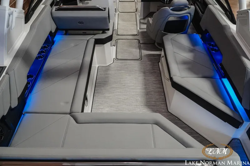 Slide: The Image of Luxurious interior of 2026 Cobalt R8 boat with blue LED lighting and plush seating. - 11