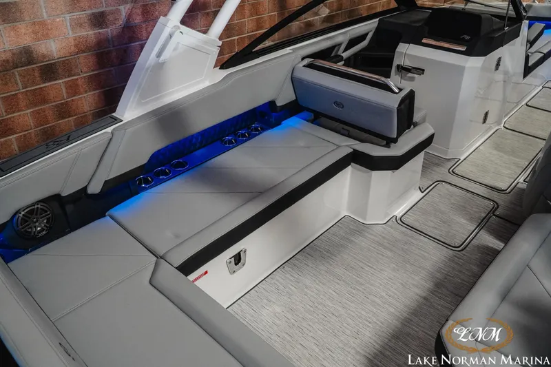 Slide: The Image of 2026 Cobalt R8 boat interior with sleek seating, blue LED lighting, and modern design. - 12