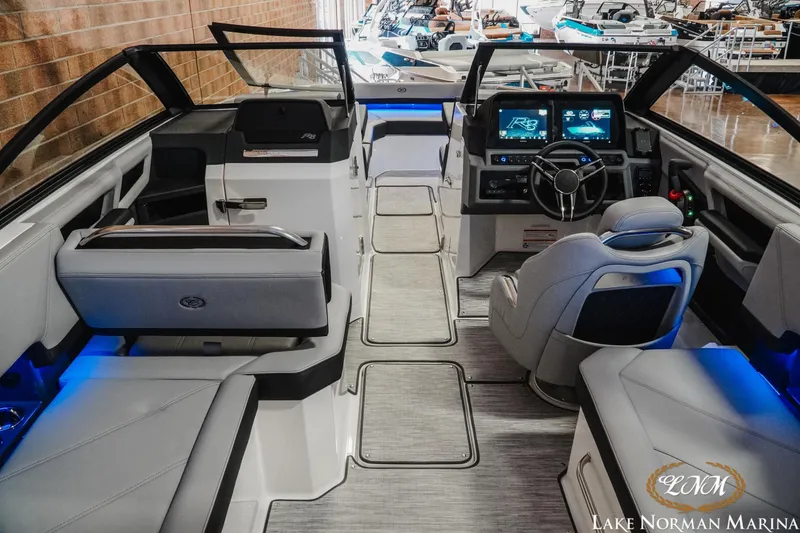 Slide: The Image of 2026 Cobalt R8 boat interior with modern dashboard and seating at Lake Norman Marina. - 13