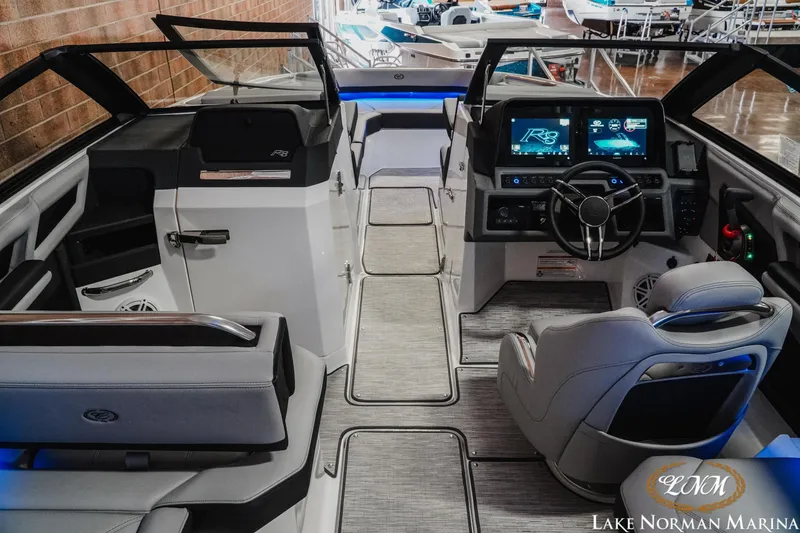 Slide: The Image of 2026 Cobalt R8 boat interior with modern dashboard and seating at Lake Norman Marina. - 14