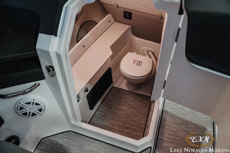 Slide: The Image of 2026 Cobalt R8 boat interior with compact marine toilet and modern design. - 21