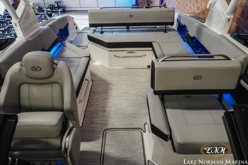 Slide: The Image of 2026 Cobalt R8 boat interior with luxurious gray seating and ambient blue lighting. - 24