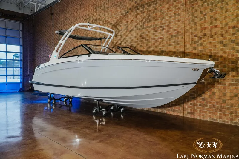 Slide: The Image of 2026 Cobalt R8 boat displayed indoors at Lake Norman Marina. - 3