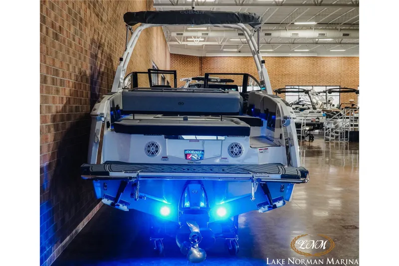 Slide: The Image of 2026 Cobalt R8 boat with blue underwater lights at Lake Norman Marina. - 8