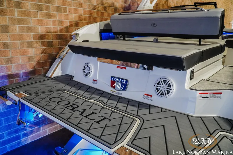 Slide: The Image of 2026 Cobalt R8 boat with cushioned seating and branded swim platform. - 9