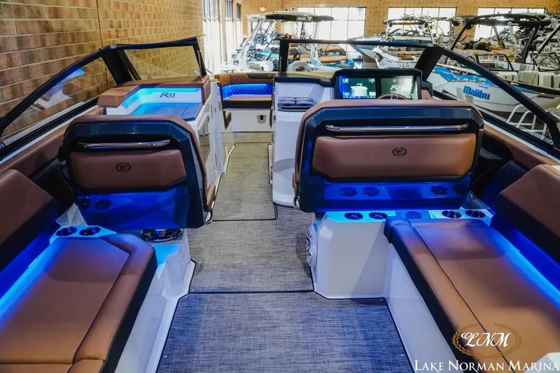 Slide: The Image of 2026 Cobalt R31 boat interior with blue LED lighting and luxurious seating at Lake Norman Marina. - 14