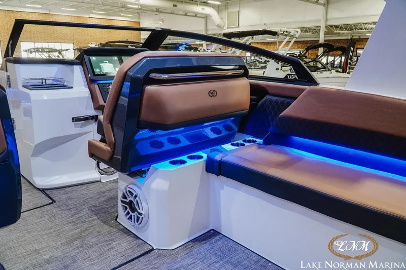 Slide: The Image of Interior of 2026 Cobalt R31 boat with modern seating and blue LED lighting. - 17