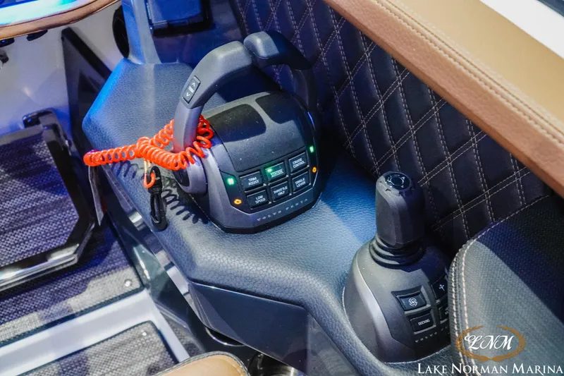 Slide: The Image of 2026 Cobalt R31 boat interior with advanced control panel and joystick. - 22
