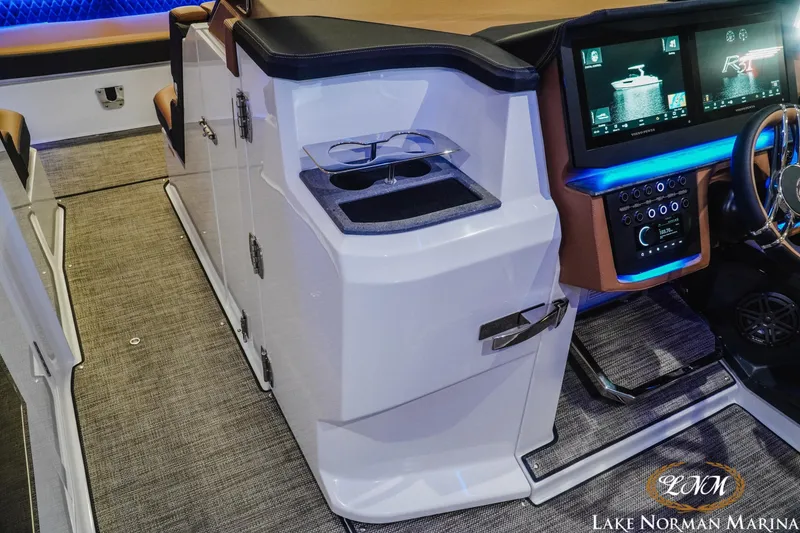 Slide: The Image of 2026 Cobalt R31 boat interior with modern dashboard and illuminated controls. - 26