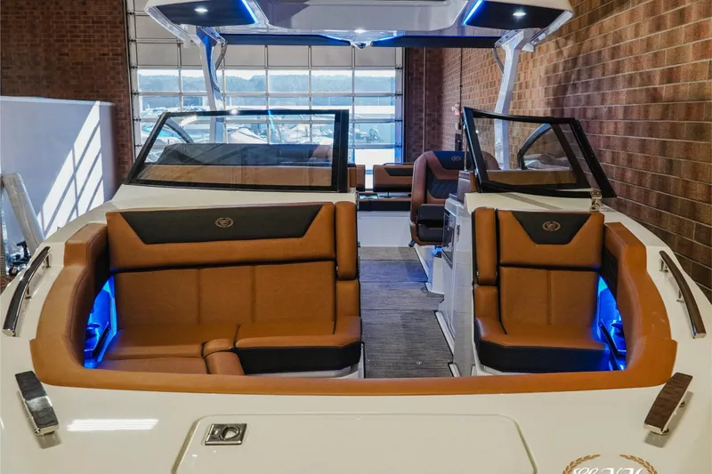 Slide: The Image of 2026 Cobalt R31 boat interior with brown leather seats and blue LED lighting. - 5
