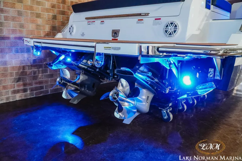 Slide: The Image of 2026 Cobalt R31 boat with illuminated propellers at Lake Norman Marina. - 9
