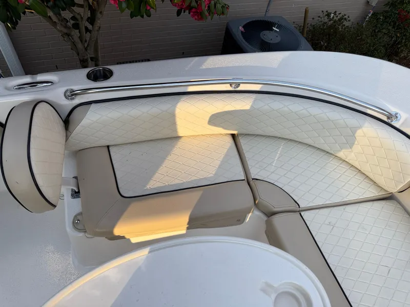 Slide: The Image of 2021 Carolina Skiff 23 Ultra Elite boat interior with white cushioned seating. - 16