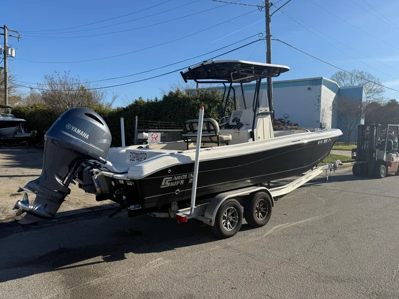 Slide: The Image of 2021 Carolina Skiff 23 Ultra Elite boat on trailer with Yamaha outboard motor. - 2