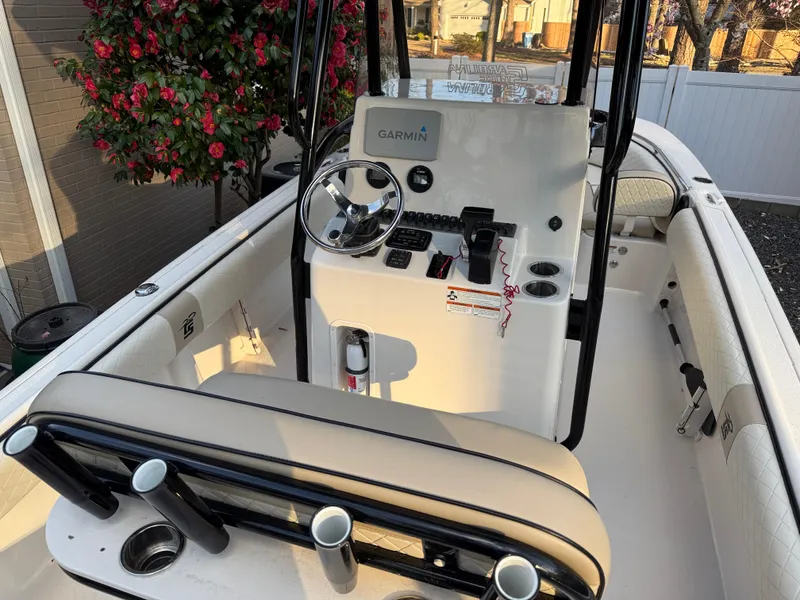Slide: The Image of 2021 Carolina Skiff 23 Ultra Elite boat interior with steering console and seating. - 7