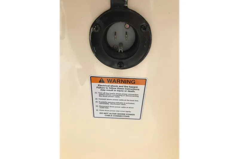 Slide: The Image of Warning label on 2019 Scout 255 Dorado boat, highlighting electrical safety instructions. - 16