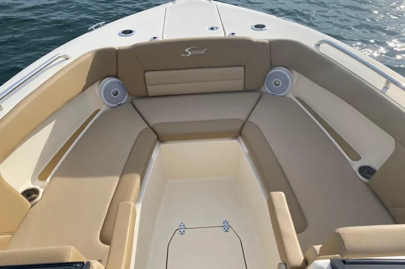 Slide: The Image of 2019 Scout 255 Dorado boat interior with beige seating and ocean view. - 7