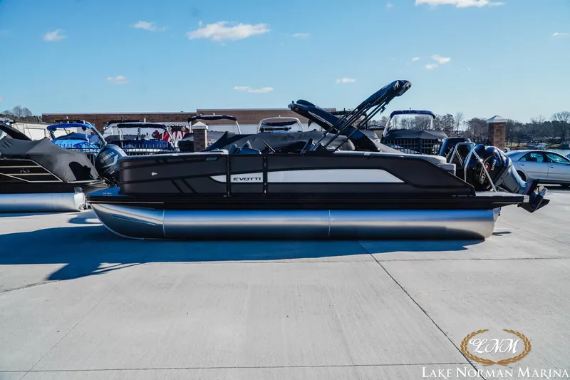 The Image of 2026 Evotti 523QL pontoon boat at Lake Norman Marina, under clear blue skies. - 1
