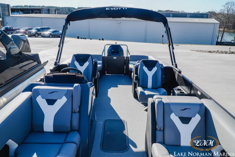 Slide: The Image of 2026 Evotti 523QL boat interior with modern seating at Lake Norman Marina. - 11