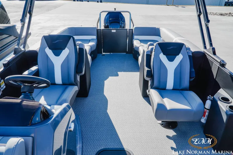 Slide: The Image of Evotti 523QL 2026 boat interior with modern seating at Lake Norman Marina. - 15