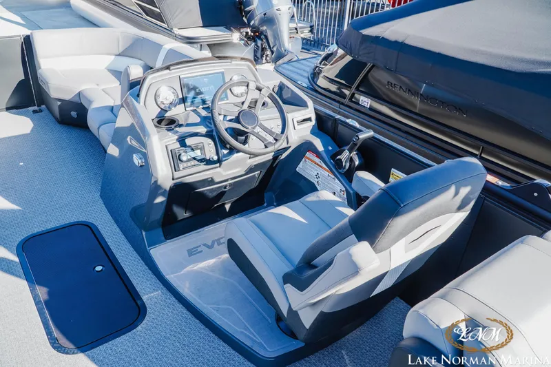 Slide: The Image of Interior of 2026 Evotti 523QL boat with modern steering console and seating. - 7