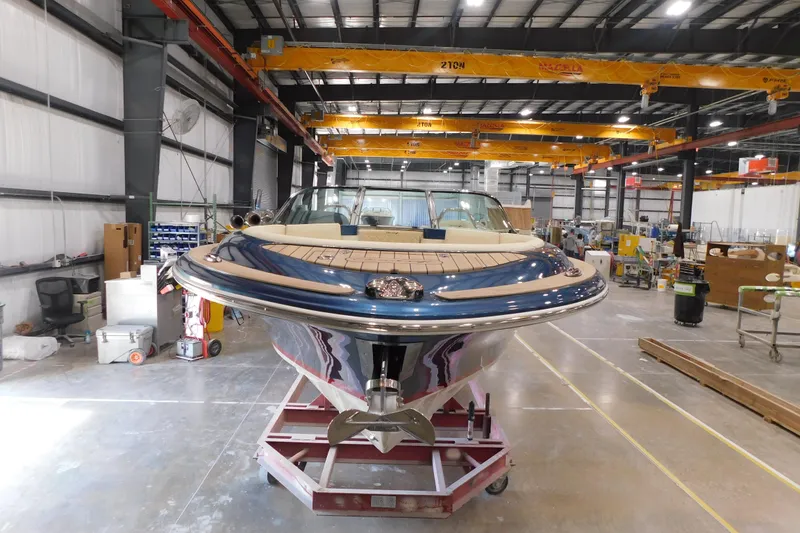 Slide: The Image of 2025 Chris-Craft Launch 27 boat in a manufacturing facility. - 14