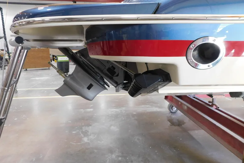 Slide: The Image of 2025 Chris-Craft Launch 27 boat stern view in a workshop setting. - 5