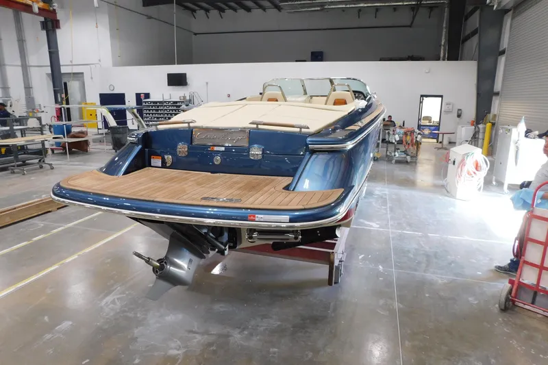 Slide: The Image of 2025 Chris-Craft Launch 27 boat in a workshop, showcasing elegant design and craftsmanship. - 6