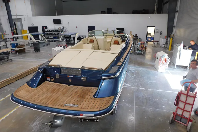 Slide: The Image of 2025 Chris-Craft Launch 27 boat in a workshop, showcasing elegant design and craftsmanship. - 7