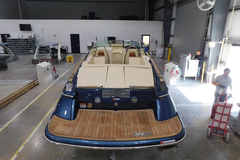 Slide: The Image of 2025 Chris-Craft Launch 27 boat in a workshop, showcasing elegant design and craftsmanship. - 9