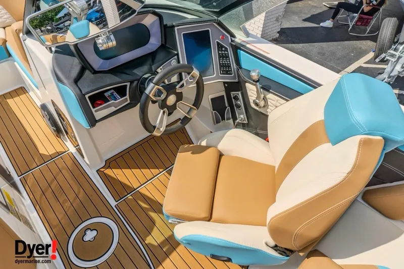 Slide: The Image of 2022 MasterCraft X24 boat interior with modern dashboard and luxurious seating. - 17