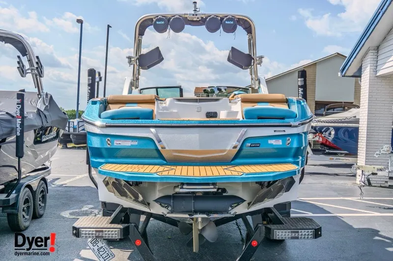 Slide: The Image of 2022 MasterCraft X24 boat displayed at Dyer Marine dealership. - 7