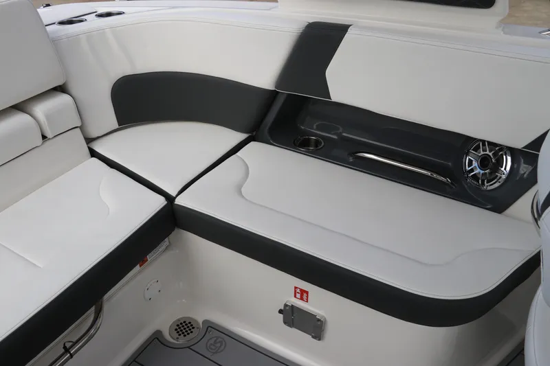 Slide: The Image of 2026 Chaparral 270 OSX boat interior with sleek seating and modern design features. - 10