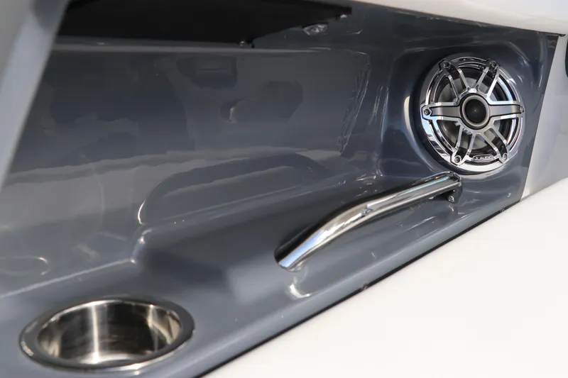 Slide: The Image of 2026 Chaparral 270 OSX boat interior with speaker, cup holder, and handle. - 12