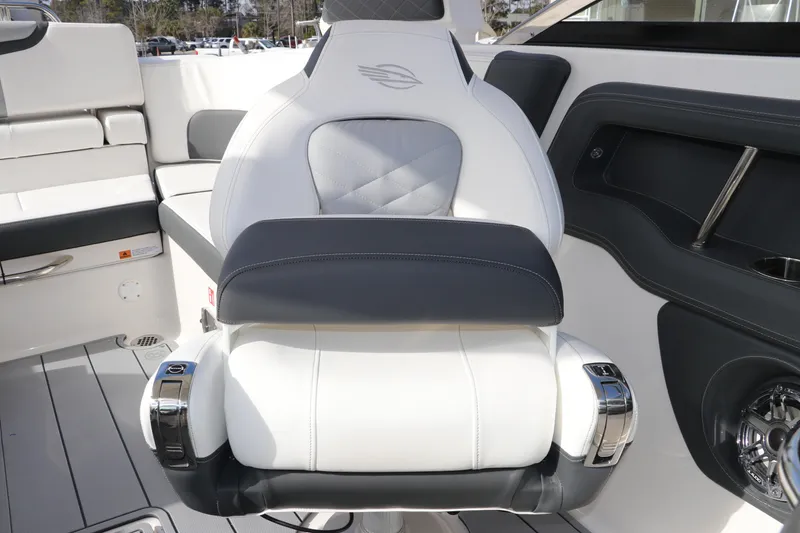 Slide: The Image of 2026 Chaparral 270 OSX boat interior with luxurious white and gray seating. - 27