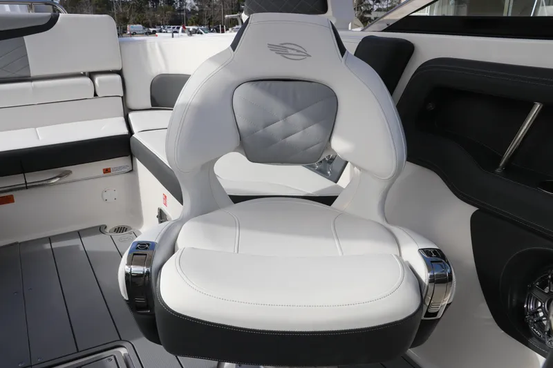 Slide: The Image of Luxury seating on 2026 Chaparral 270 OSX boat, featuring sleek white and gray design. - 28