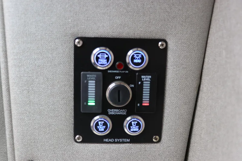 Slide: The Image of Control panel of 2026 Chaparral 270 OSX boat's head system, showing waste and water levels. - 32
