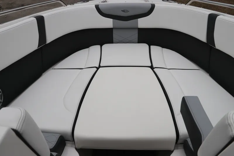 Slide: The Image of 2026 Chaparral 270 OSX boat interior with luxurious white and black seating. - 43