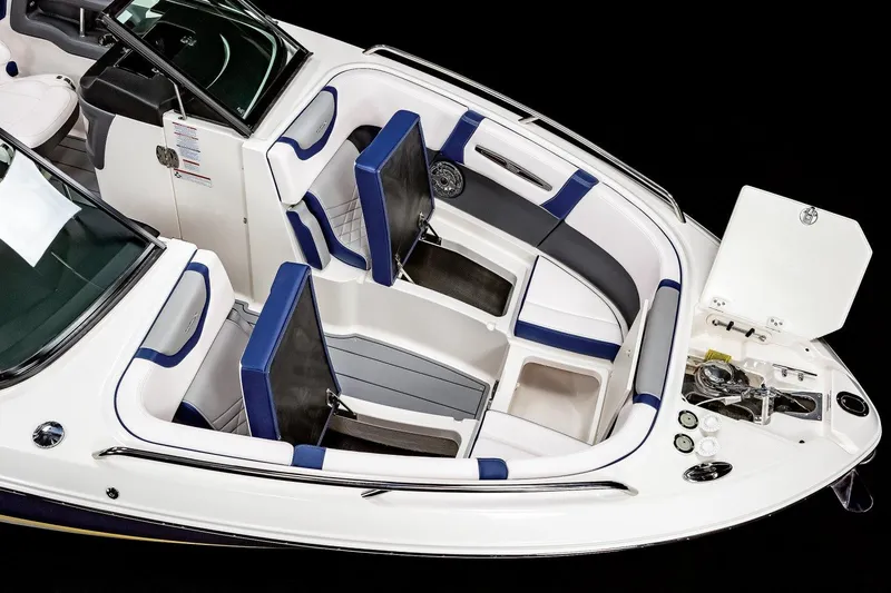 Slide: The Image of 2026 Chaparral 270 OSX boat interior with sleek seating and a stylish table. - 7