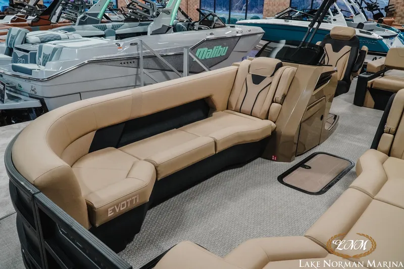 Slide: The Image of Luxurious 2026 Evotti 725CS boat interior with plush seating at Lake Norman Marina. - 10
