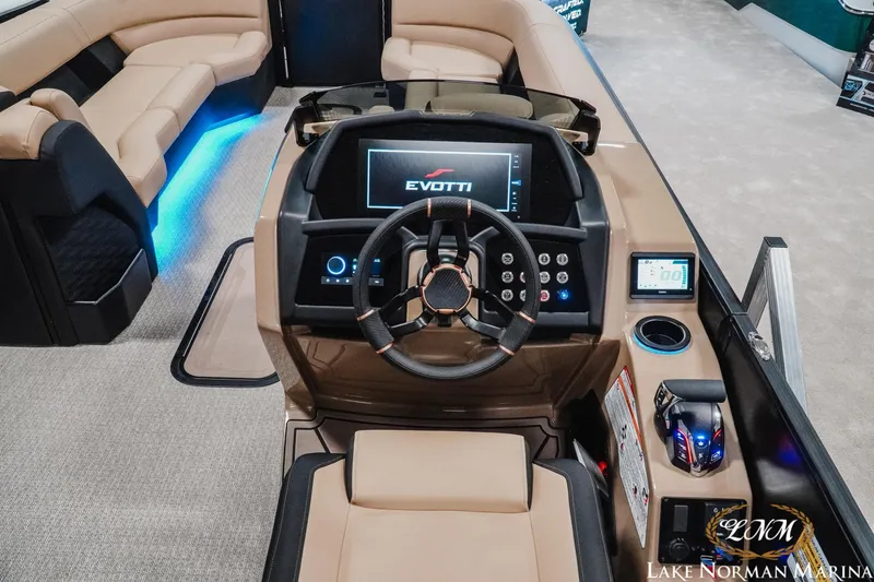 Slide: The Image of 2026 Evotti 725CS boat interior with modern dashboard and seating at Lake Norman Marina. - 20