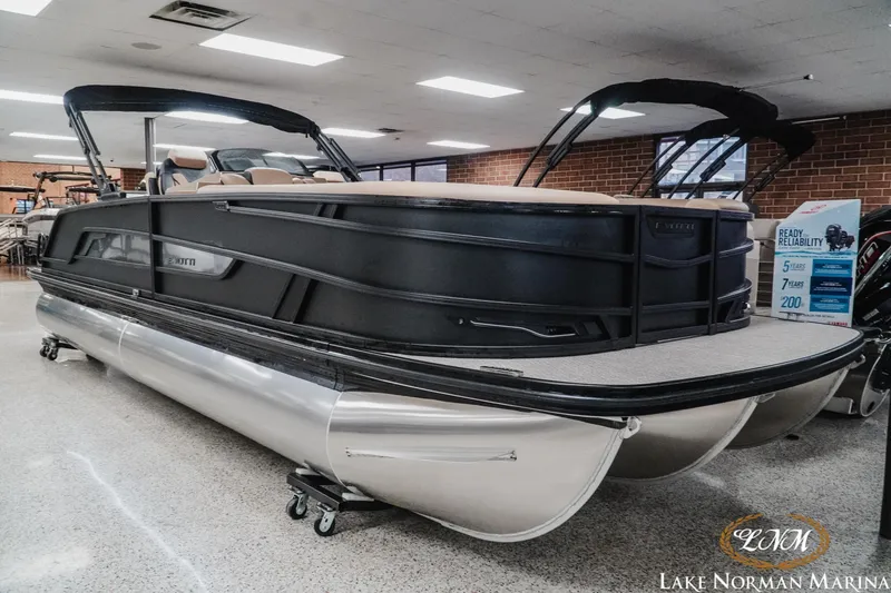 Slide: The Image of 2026 Evotti 725CS pontoon boat displayed at Lake Norman Marina showroom. - 5