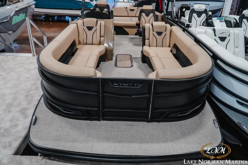 Slide: The Image of 2026 Evotti 725CS pontoon boat with beige seating at Lake Norman Marina. - 7