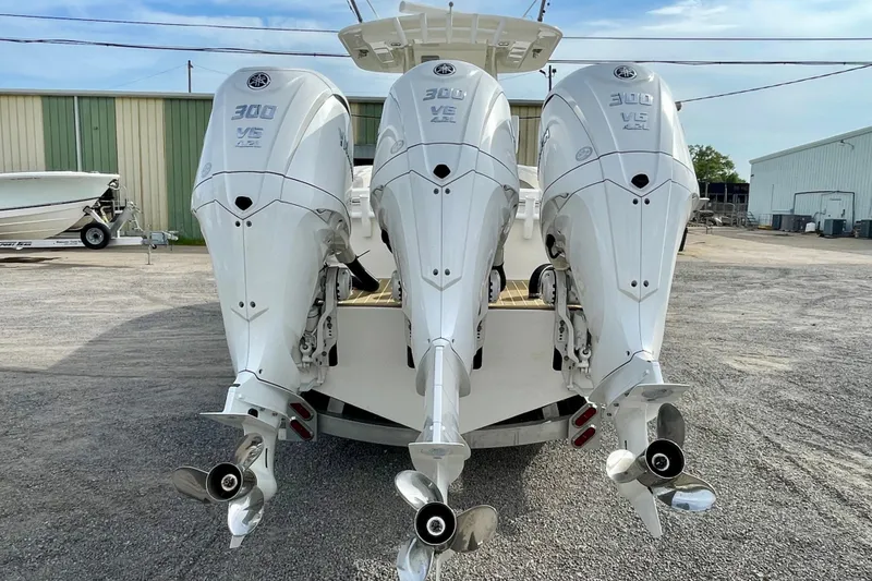 Slide: The Image of Triple Yamaha 300 V6 outboard engines on a 2023 Regulator 34 boat. - 11